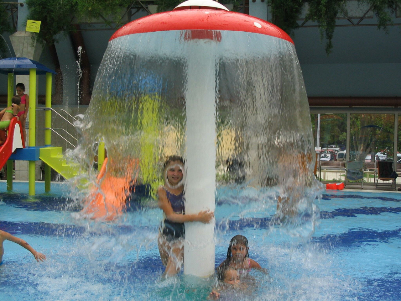 Well timed photo of girl behind waterfall